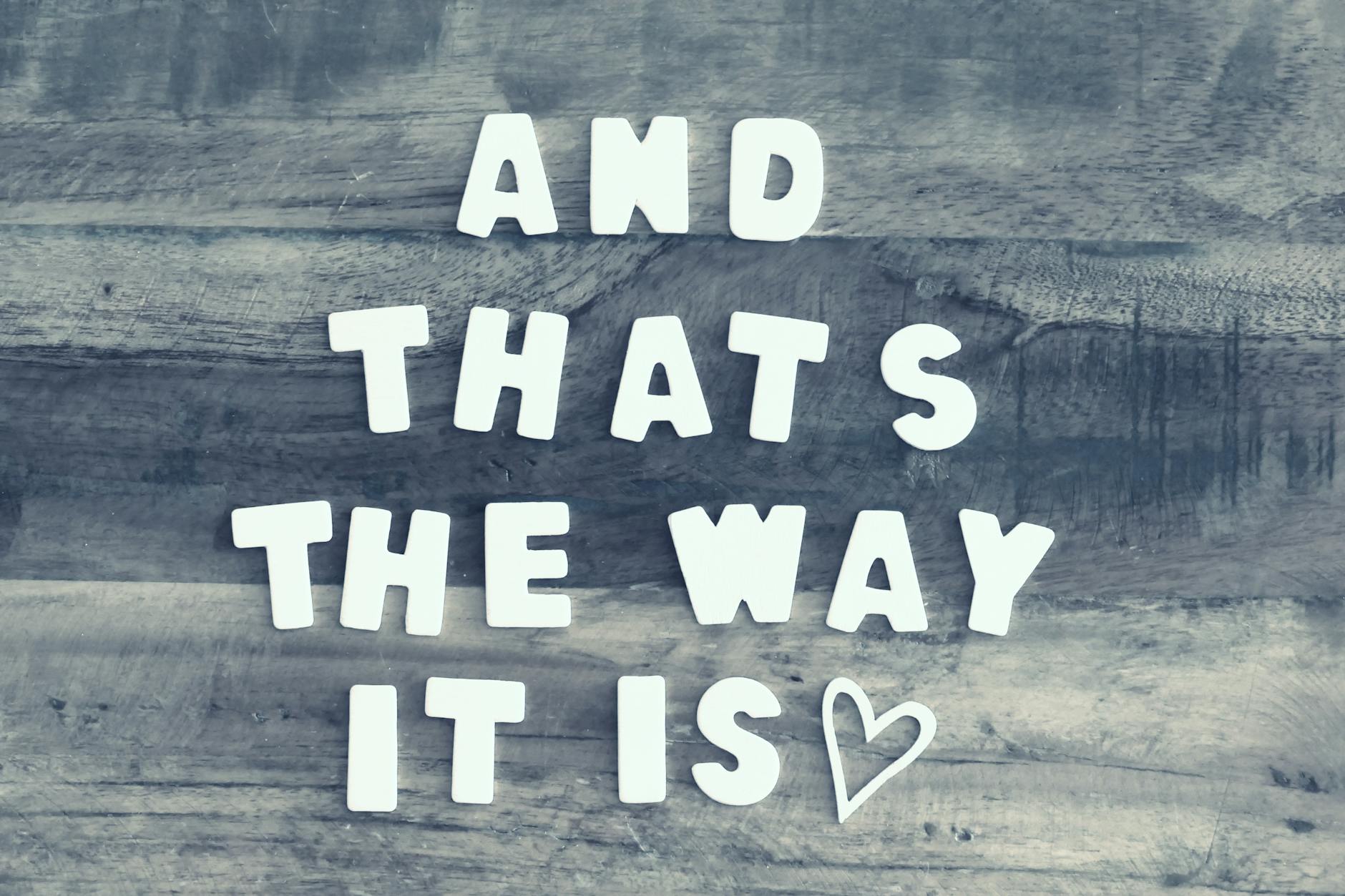 inspiring quote on wooden surface